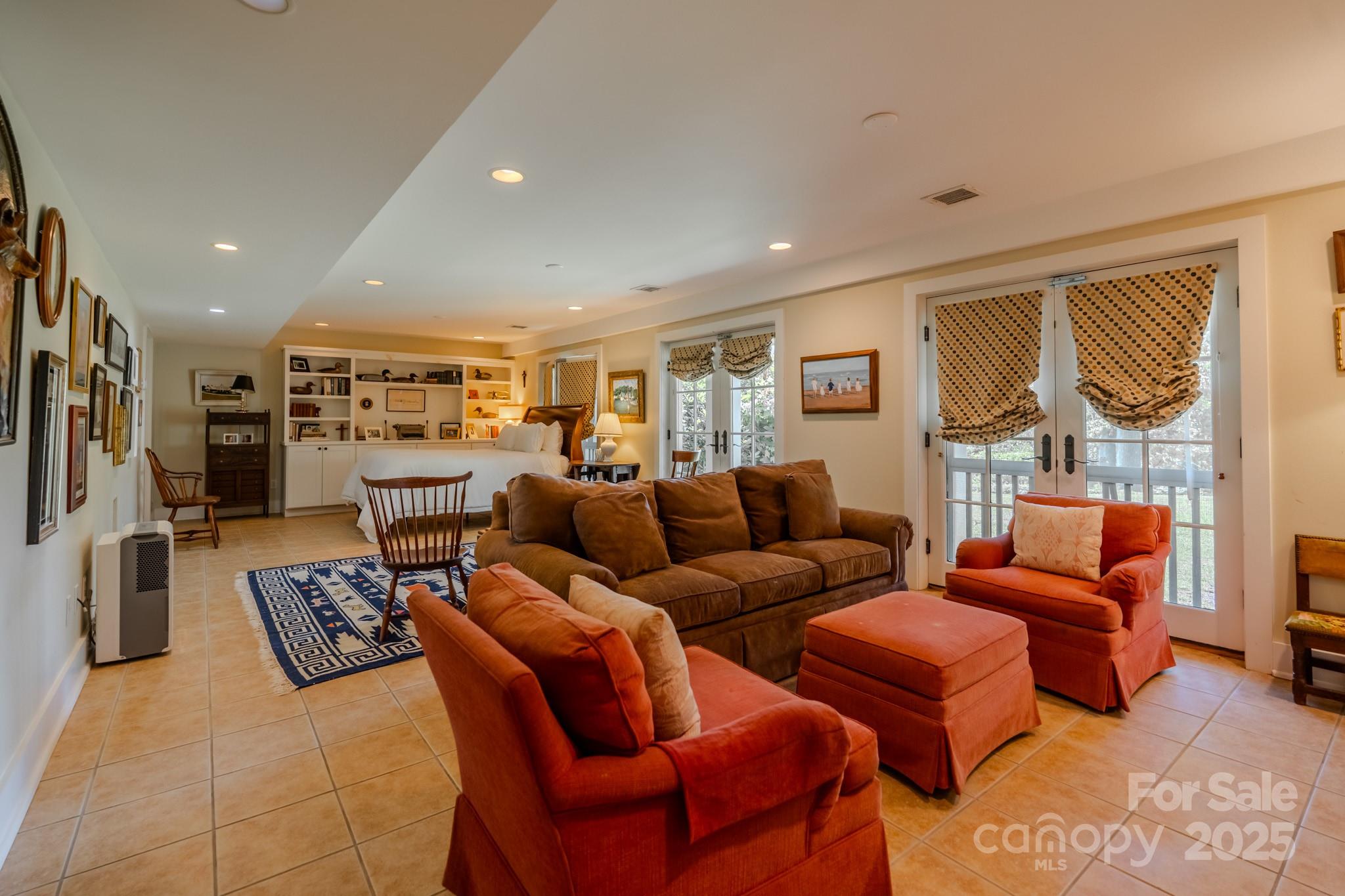 650 Golf Course Road Tryon, NC 28782 - Photo 34 of 48 a living room with furniture ceiling fan and a rug