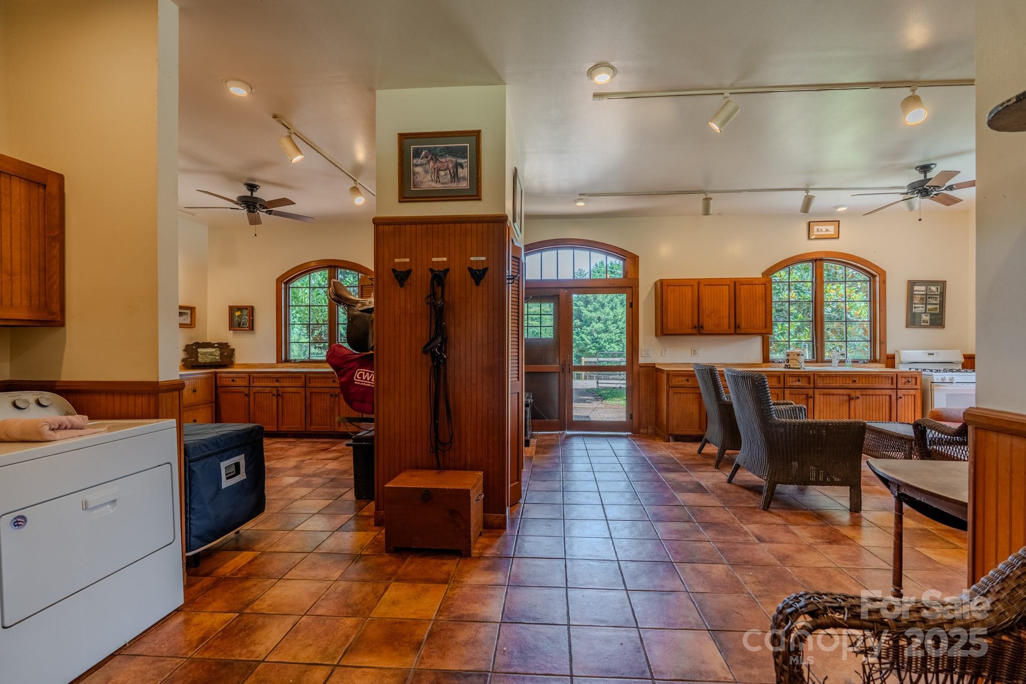 650 Golf Course Road Tryon, NC 28782 - Photo 40 of 48 a room with lots of wooden furniture and cabinets