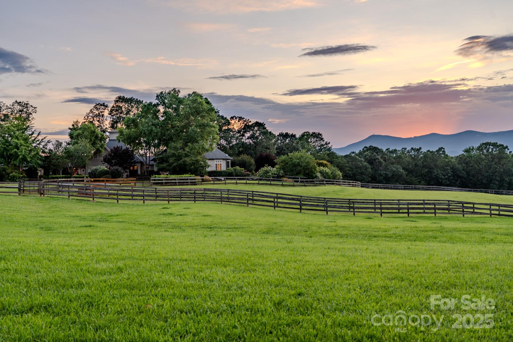 650 Golf Course Road Tryon, NC 28782 - Photo 4 of 48 a view of a golf course with a lake