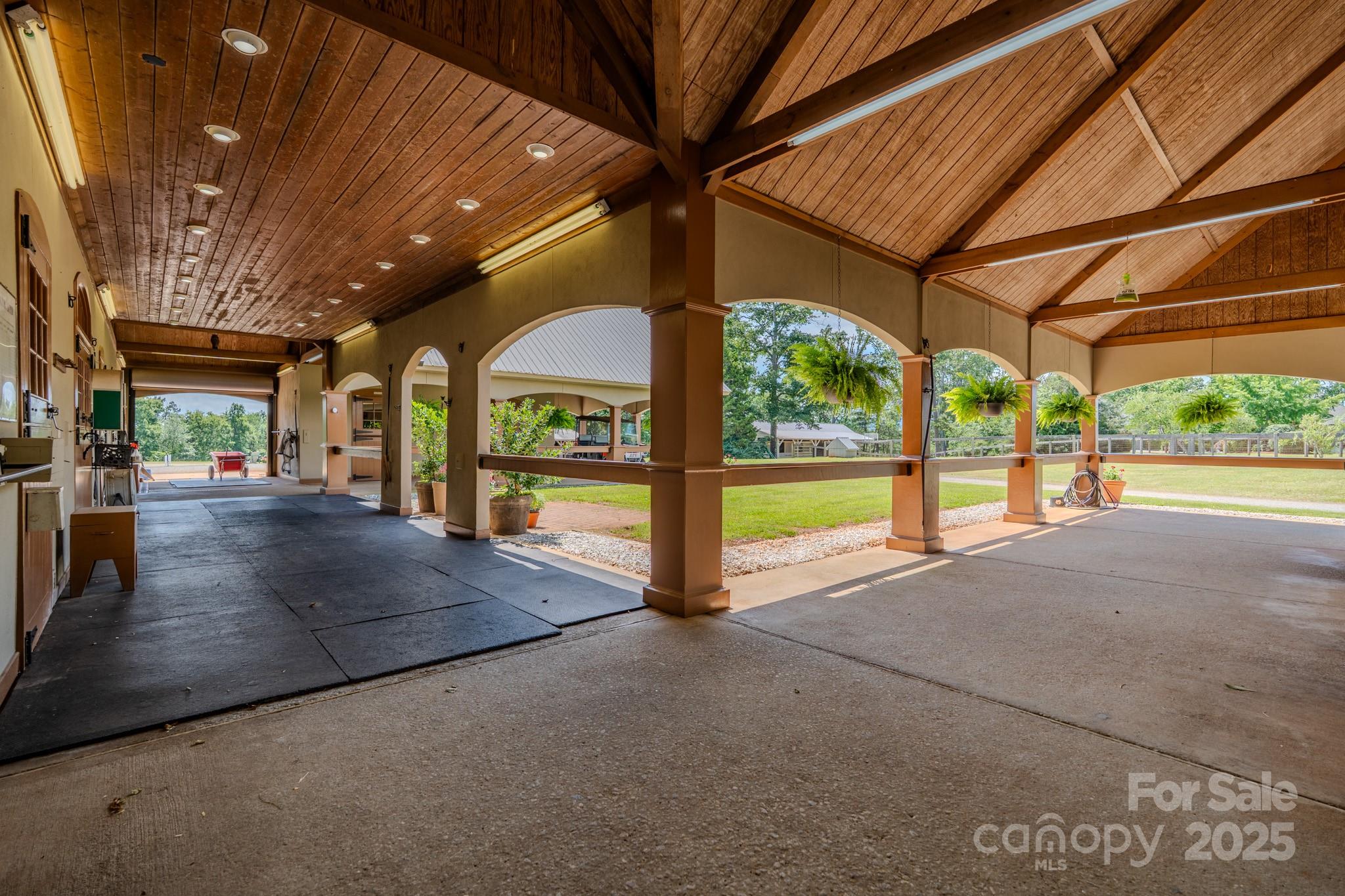 650 Golf Course Road Tryon, NC 28782 - Photo 43 of 48 a view of an chairs and tables in the patio