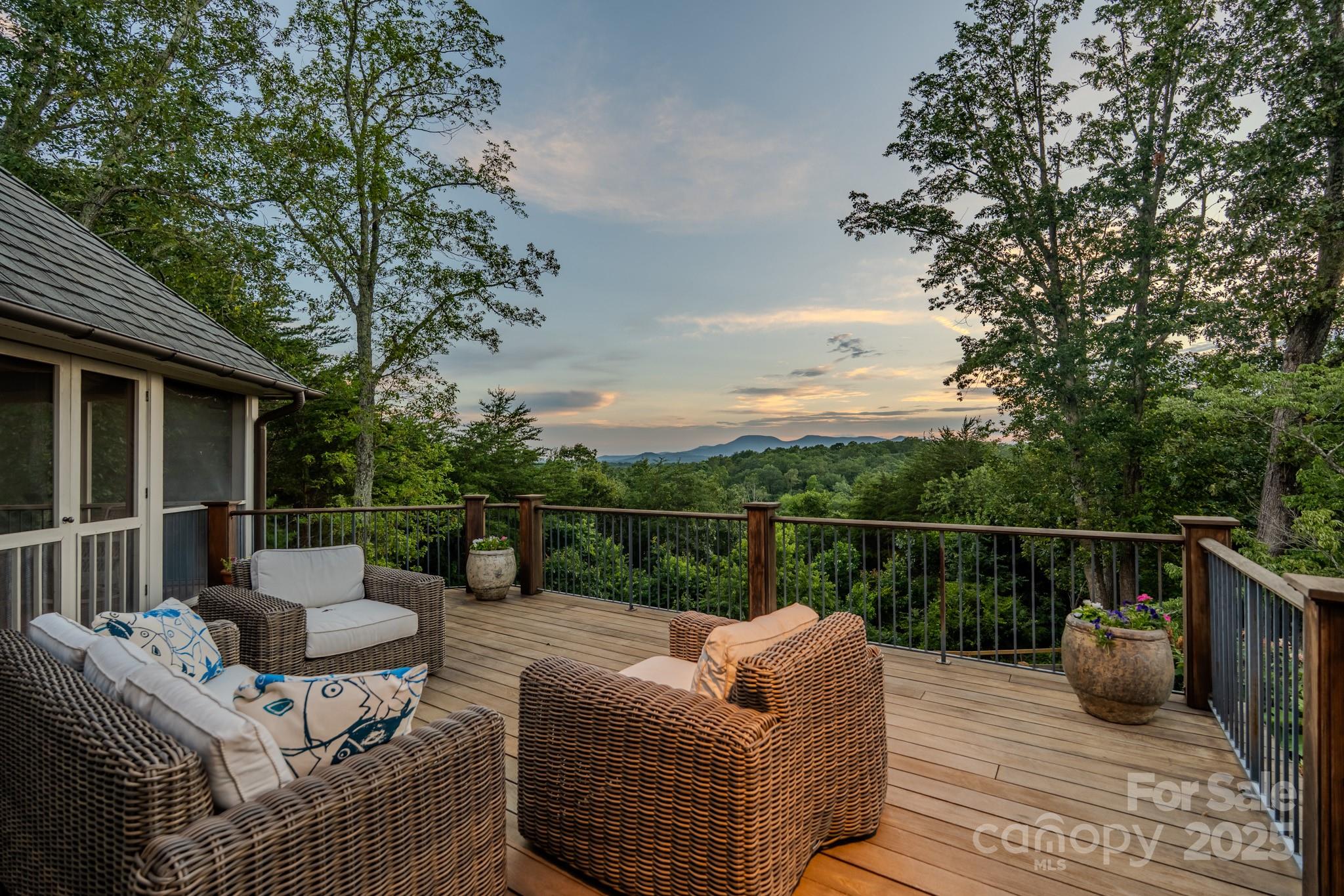 650 Golf Course Road Tryon, NC 28782 - Photo 5 of 48 a view of roof deck with couches and wooden floor