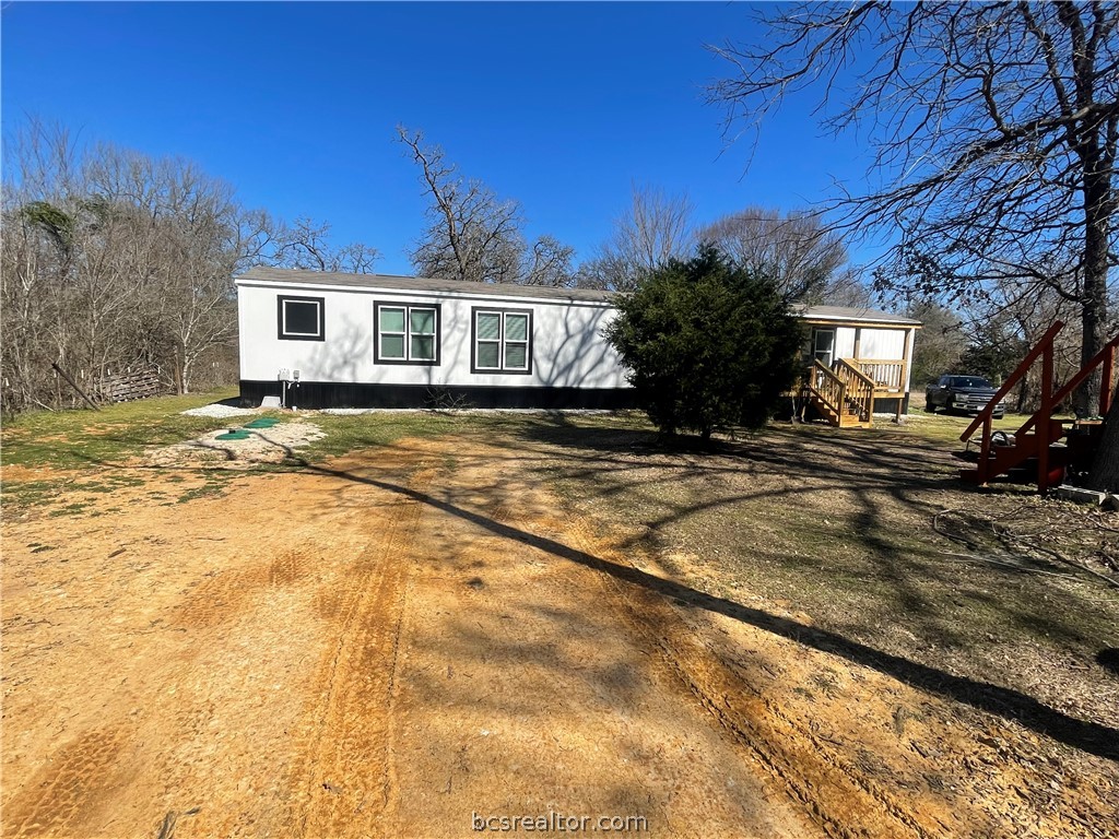 11320 Old Hearne Road Bryan, TX 77807 - Photo 15 of 26 a view of a house with a patio