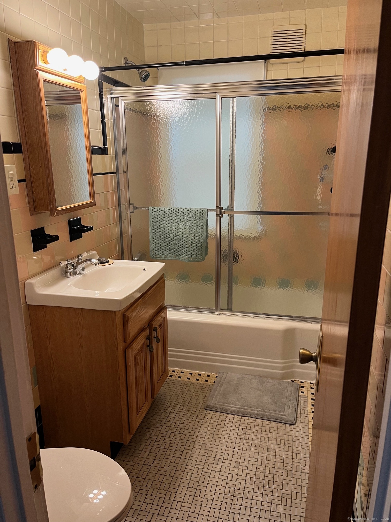 18 Coe Lane Ansonia, CT 06401 - Photo 12 of 12 a bathroom with a sink a toilet and shower