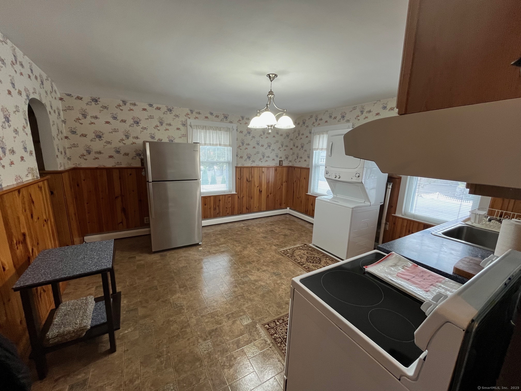 18 Coe Lane Ansonia, CT 06401 - Photo 3 of 12 a view of kitchen with furniture and a refrigerator