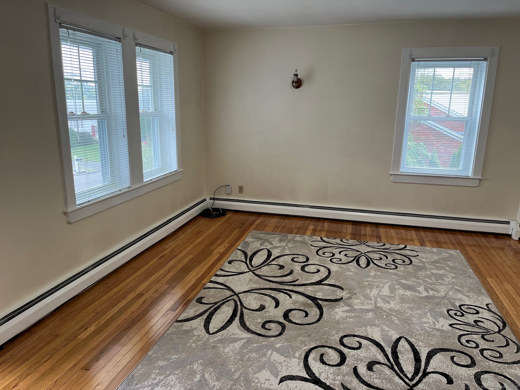18 Coe Lane Ansonia, CT 06401 - Photo 7 of 12 a view of an empty room and window