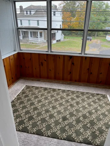 a view of an empty room and window