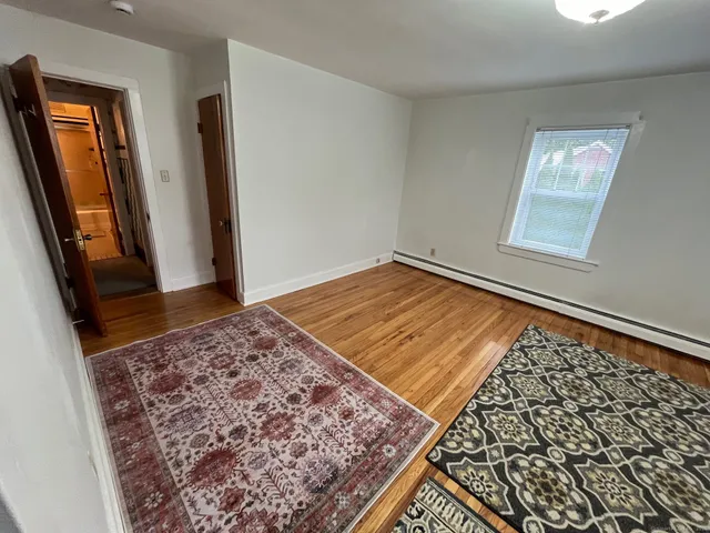 a view of a living room with a rug