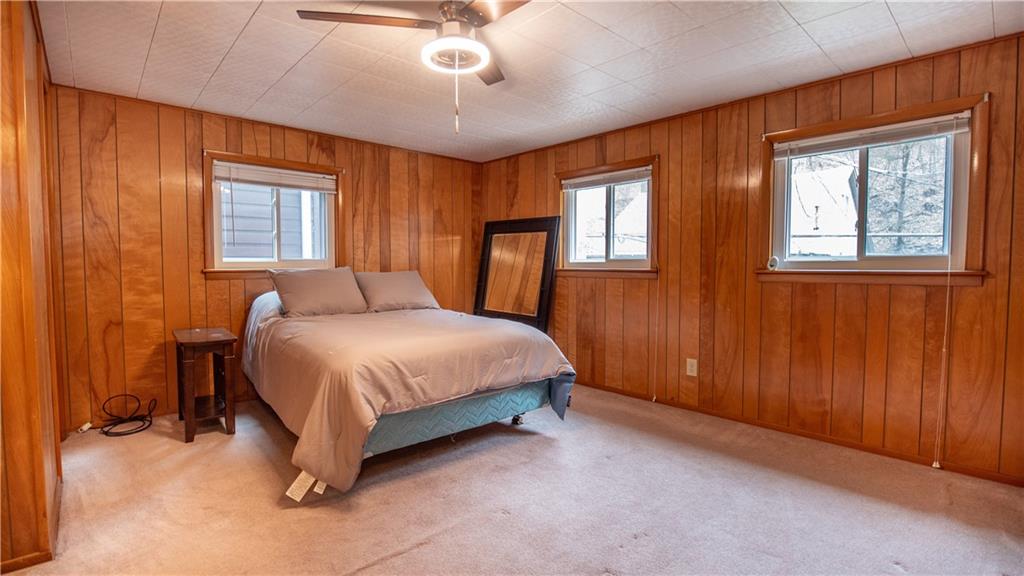 136 Clarks Pike Road Creighton, PA 15030 - Photo 14 of 27 a spacious bedroom with a bed and a window