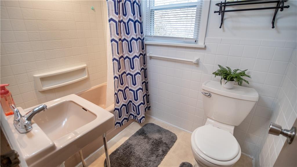 136 Clarks Pike Road Creighton, PA 15030 - Photo 18 of 27 a white toilet sitting next to a bathroom sink