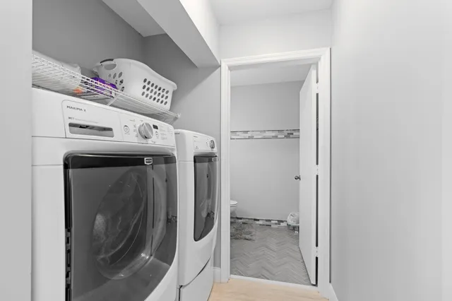 a utility room with dryer and washer