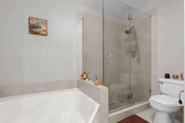 a bathroom with a bathtub and a shower