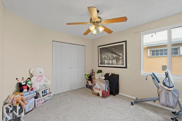 a bedroom with furniture and a window