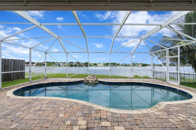 a view of swimming pool with outdoor seating