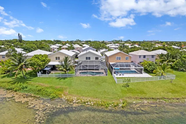 a view of a city with lots of buildings and ocean view
