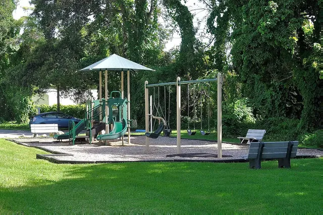 a view of a garden with a house