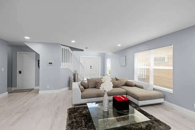 a living room with furniture and a window