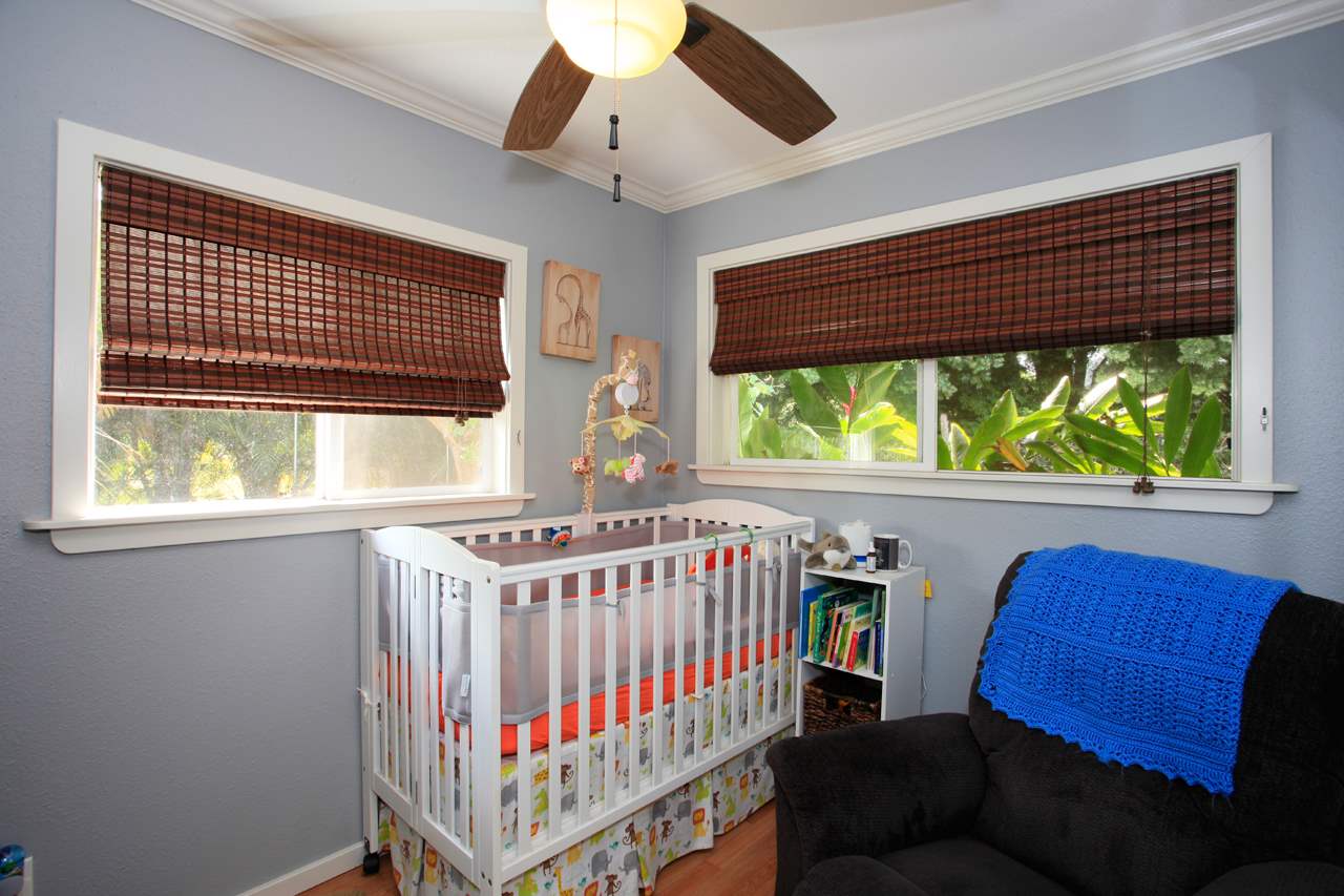 2811 Kokomo Road Haiku, HI 96708 - Photo 28 of 30 a bedroom with furniture and a window