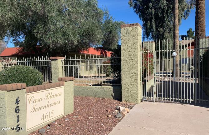 4615 North 39th Avenue, Unit 15 Phoenix, AZ 85019 - Photo 1 of 1 a view of a park with iron fence