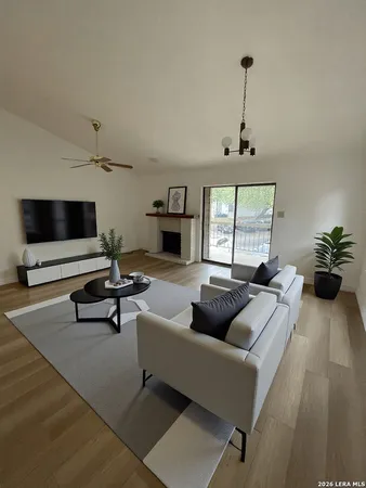 a living room with furniture and a flat screen tv