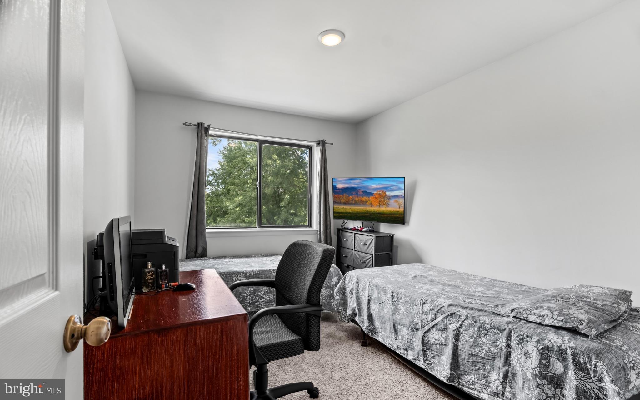 68 Liborio Lane New Castle, DE 19720 - Photo 21 of 38 a bedroom with a bed and a flat screen tv