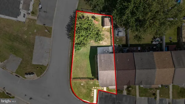an aerial view of a house with a swimming pool