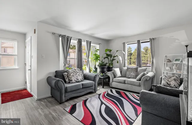 a living room with furniture and windows