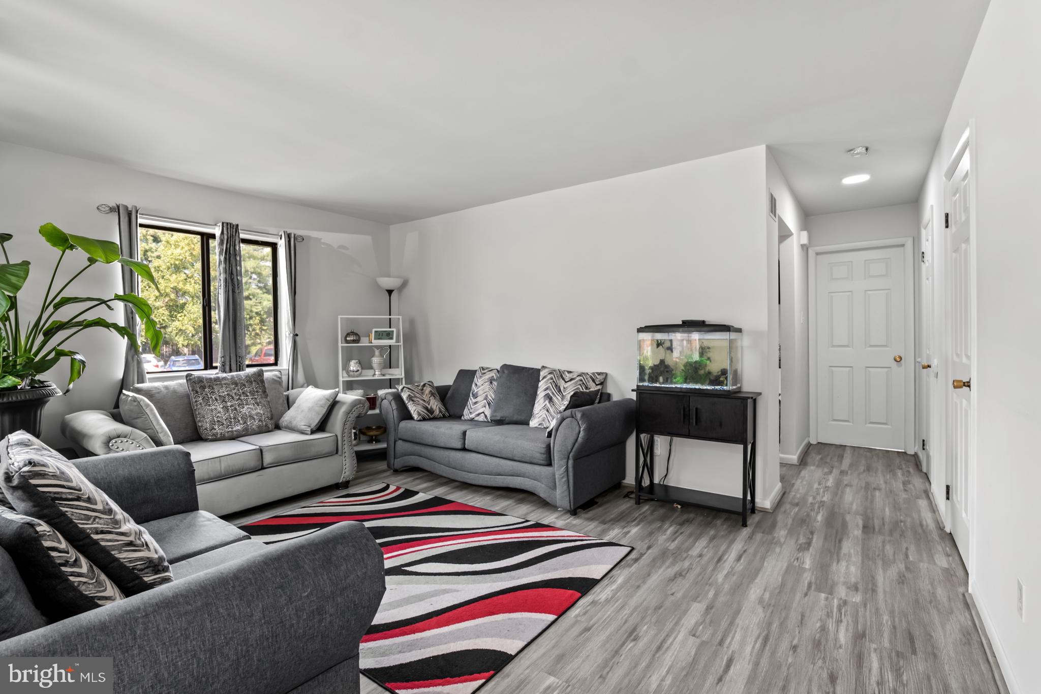 68 Liborio Lane New Castle, DE 19720 - Photo 7 of 38 a living room with furniture and a wooden floor