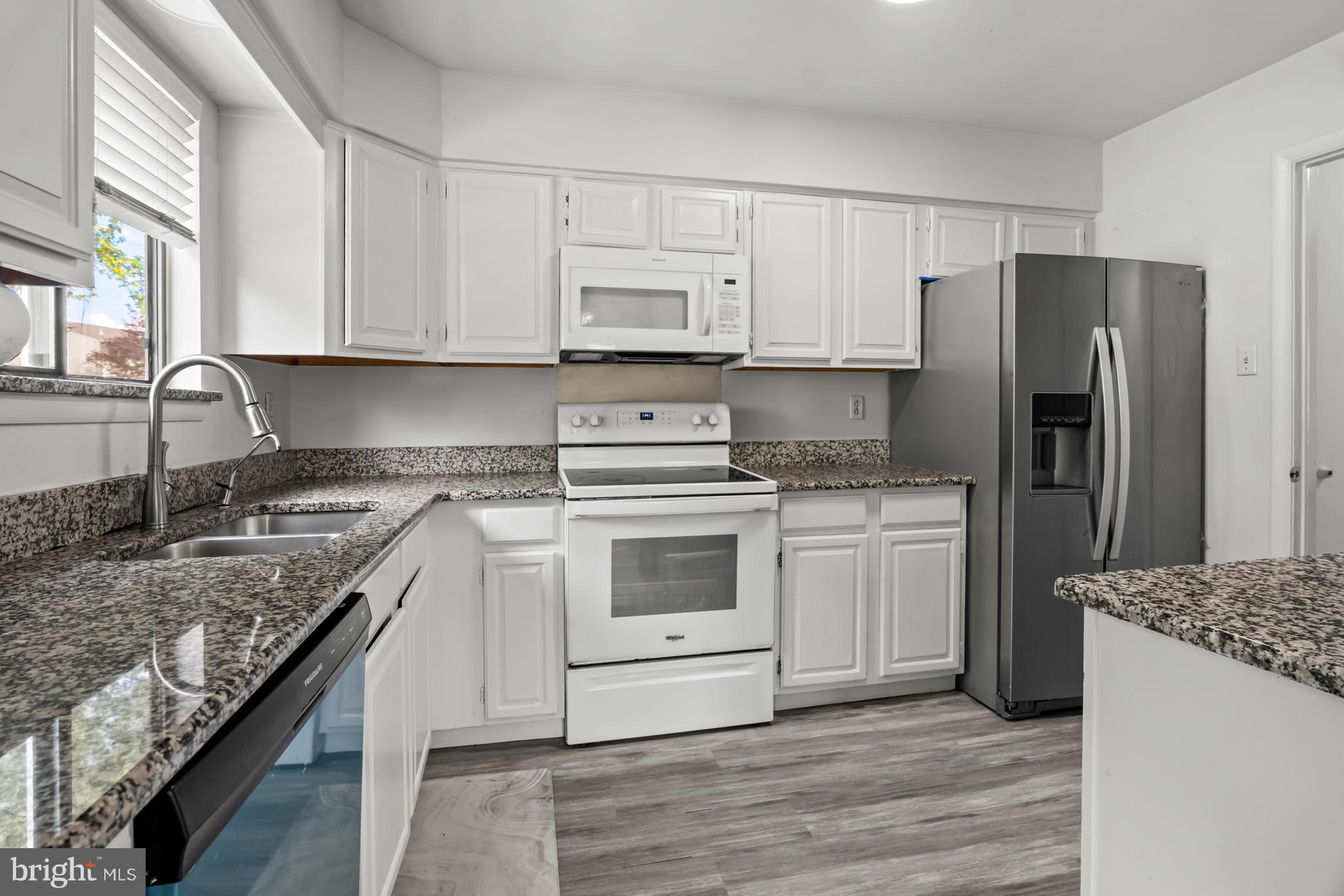 68 Liborio Lane New Castle, DE 19720 - Photo 10 of 38 a kitchen with a stove a sink and a refrigerator