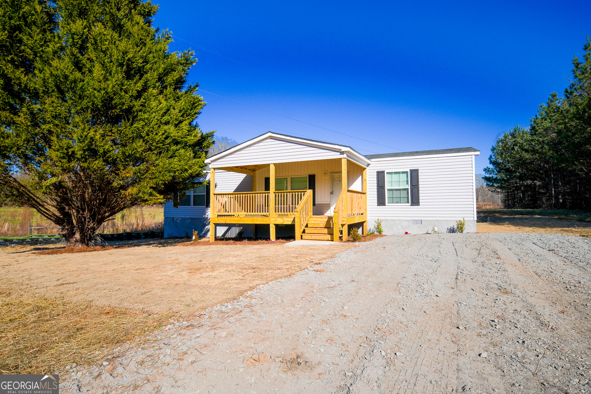 1501 Launius Road Good Hope, GA 30641 - Photo 1 of 1 a view of a house with a snow in the yard