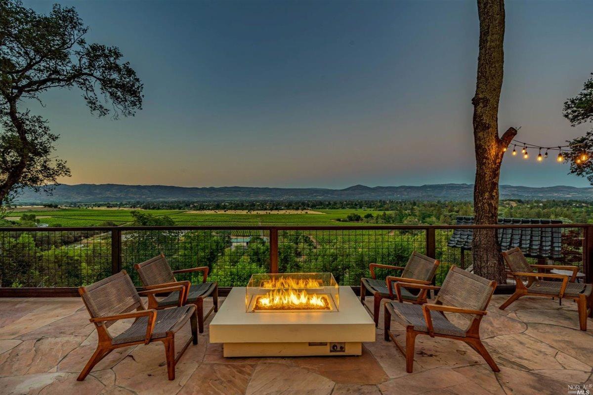 3111 Redwood Road Napa, CA 94558 - Photo 1 of 1 an outdoor sitting area with furniture and a lake view