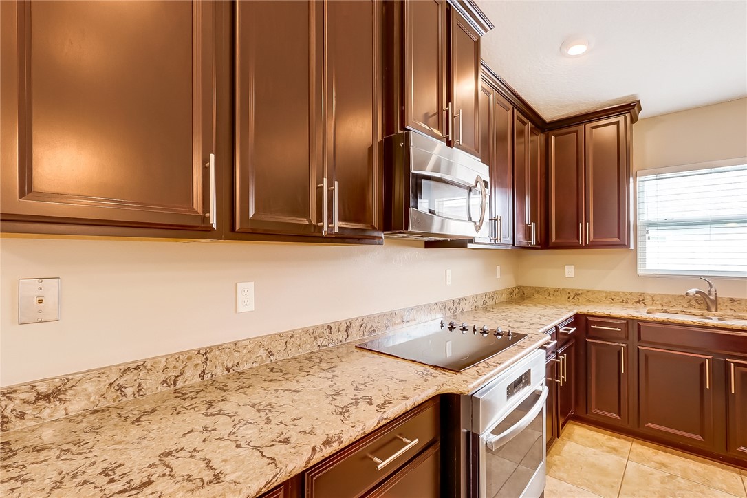 95227 Windflower Trail Fernandina Beach, FL 32034 - Photo 12 of 35 a kitchen with a sink cabinets and window