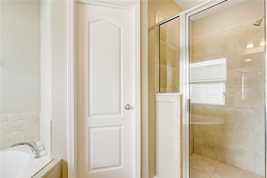 95227 Windflower Trail Fernandina Beach, FL 32034 - Photo 20 of 35 a bathroom with a tub and shower