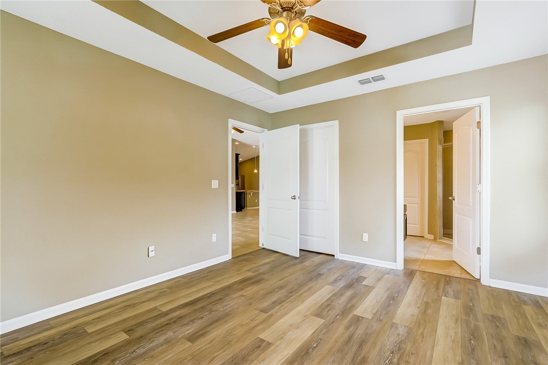 95227 Windflower Trail Fernandina Beach, FL 32034 - Photo 23 of 35 wooden floor in an empty room with a window