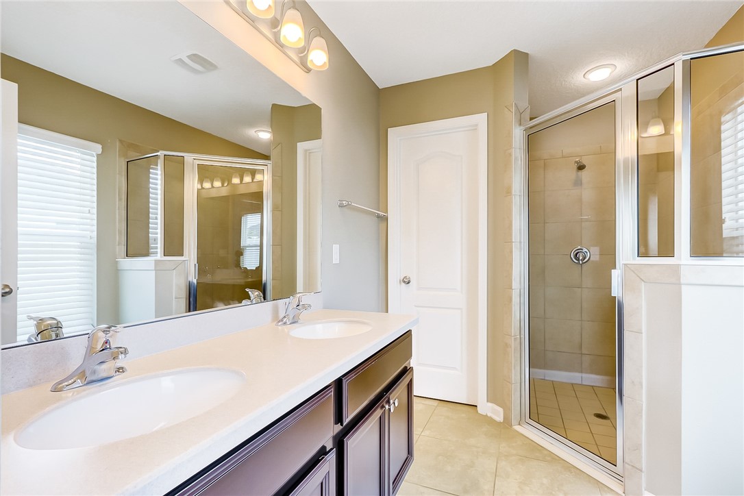 95227 Windflower Trail Fernandina Beach, FL 32034 - Photo 24 of 35 a bathroom with a sink and a mirror