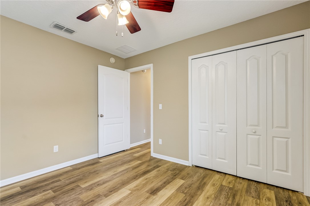 95227 Windflower Trail Fernandina Beach, FL 32034 - Photo 29 of 35 a view of an empty room with wooden floor