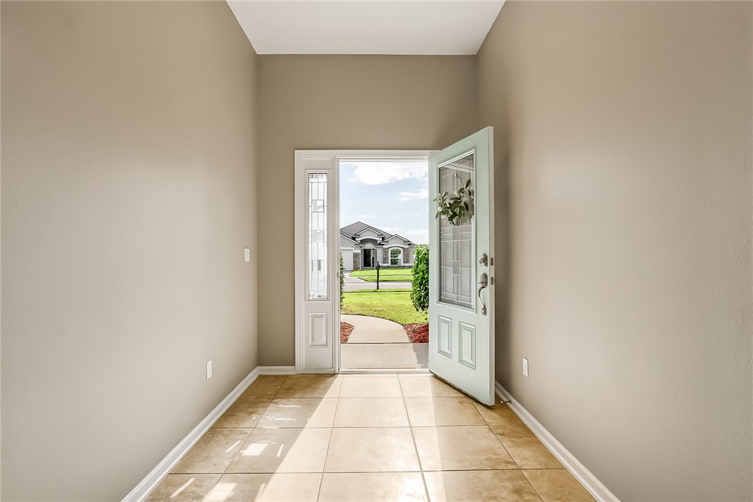 95227 Windflower Trail Fernandina Beach, FL 32034 - Photo 6 of 35 a view of a hallway with bathroom and a window