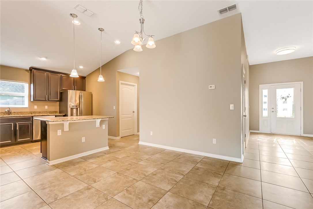 95227 Windflower Trail Fernandina Beach, FL 32034 - Photo 10 of 35 a large kitchen with cabinets and stainless steel appliances