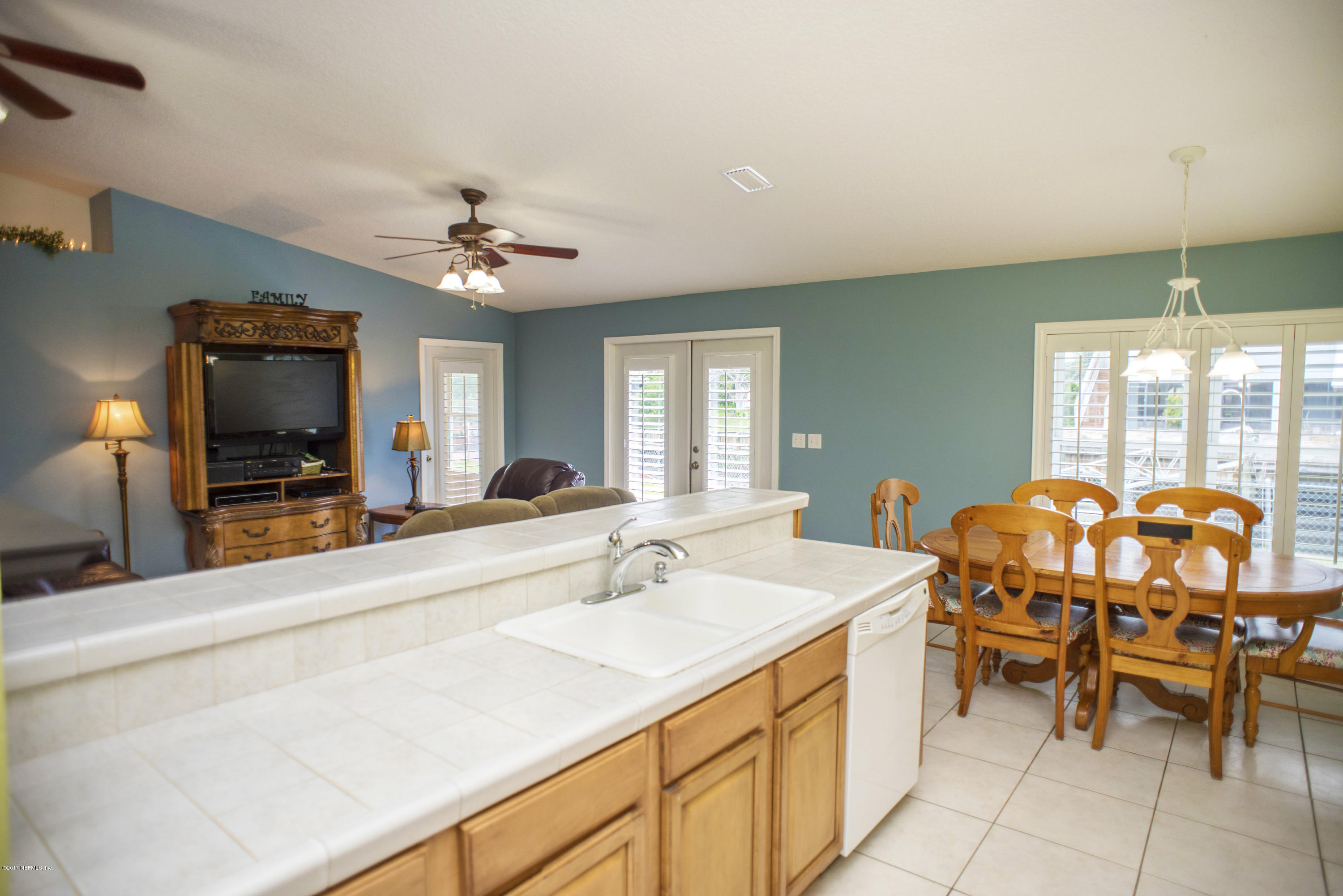 244 Barco Road St. Augustine, FL 32080 - Photo 11 of 31 a view of a kitchen area with furniture and chandelier