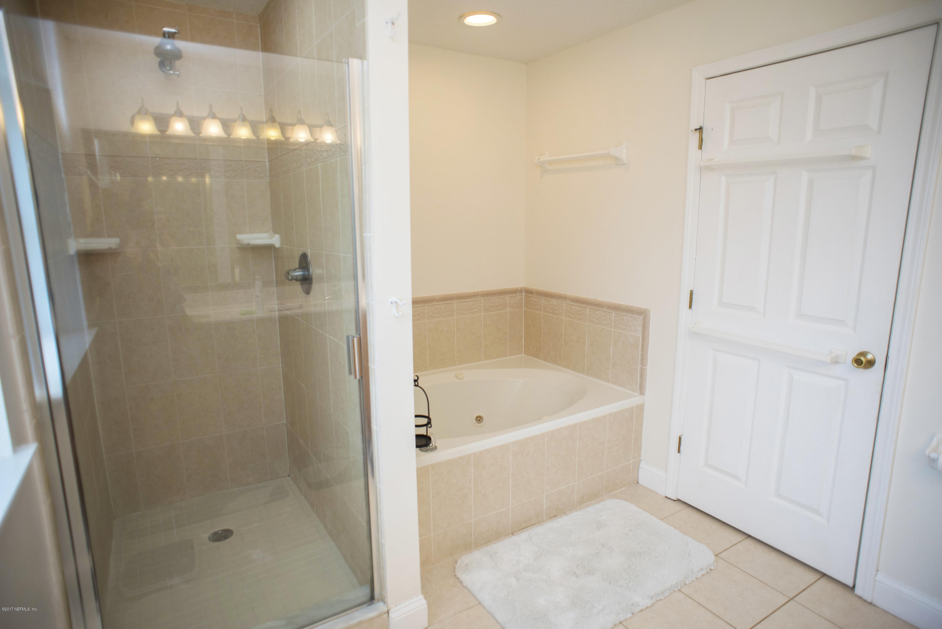 244 Barco Road St. Augustine, FL 32080 - Photo 14 of 31 a white bath tub sitting next to a shower