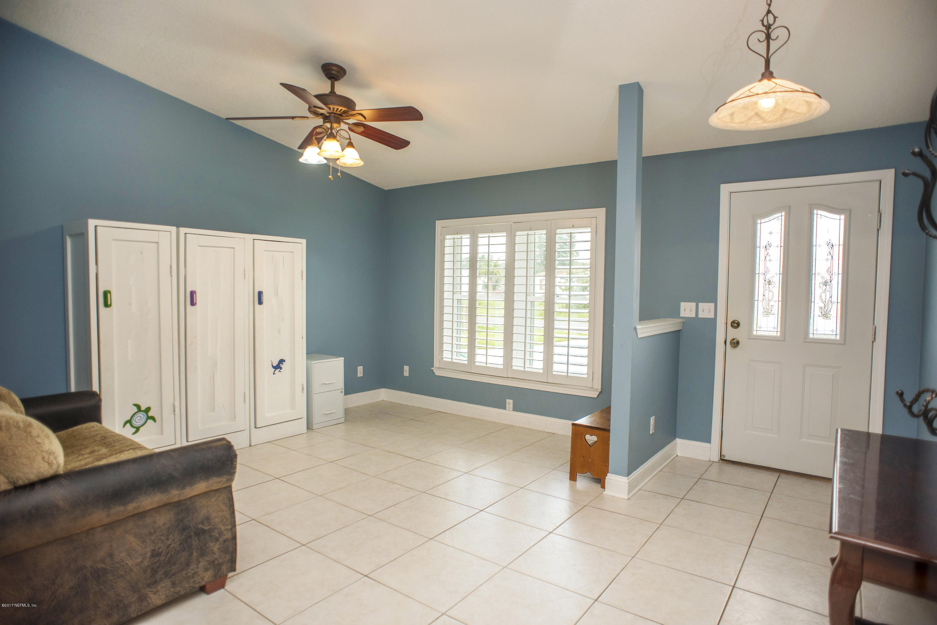 244 Barco Road St. Augustine, FL 32080 - Photo 4 of 31 a view of an empty room with a window and a livingroom
