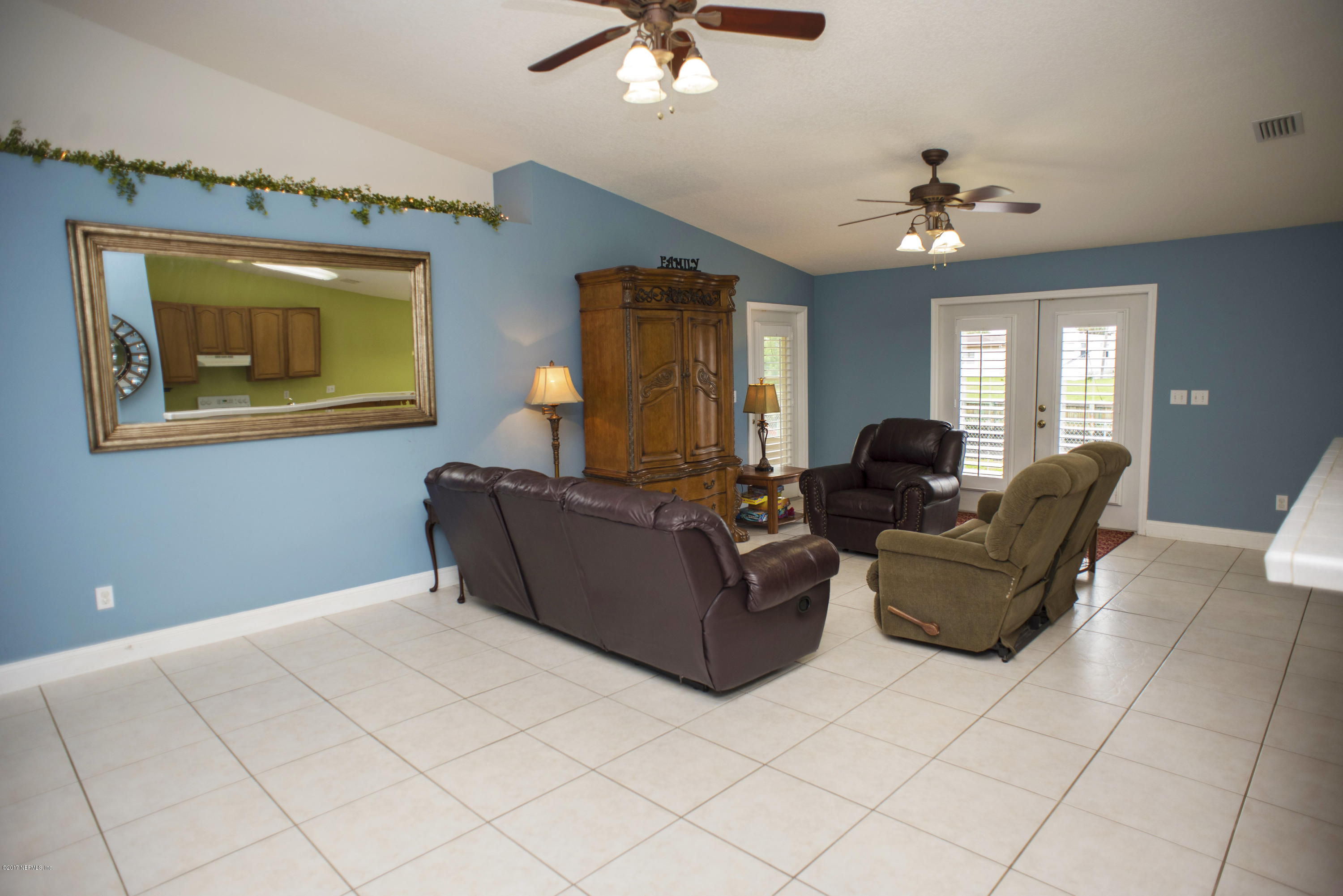 244 Barco Road St. Augustine, FL 32080 - Photo 5 of 31 a living room with furniture and a ceiling fan