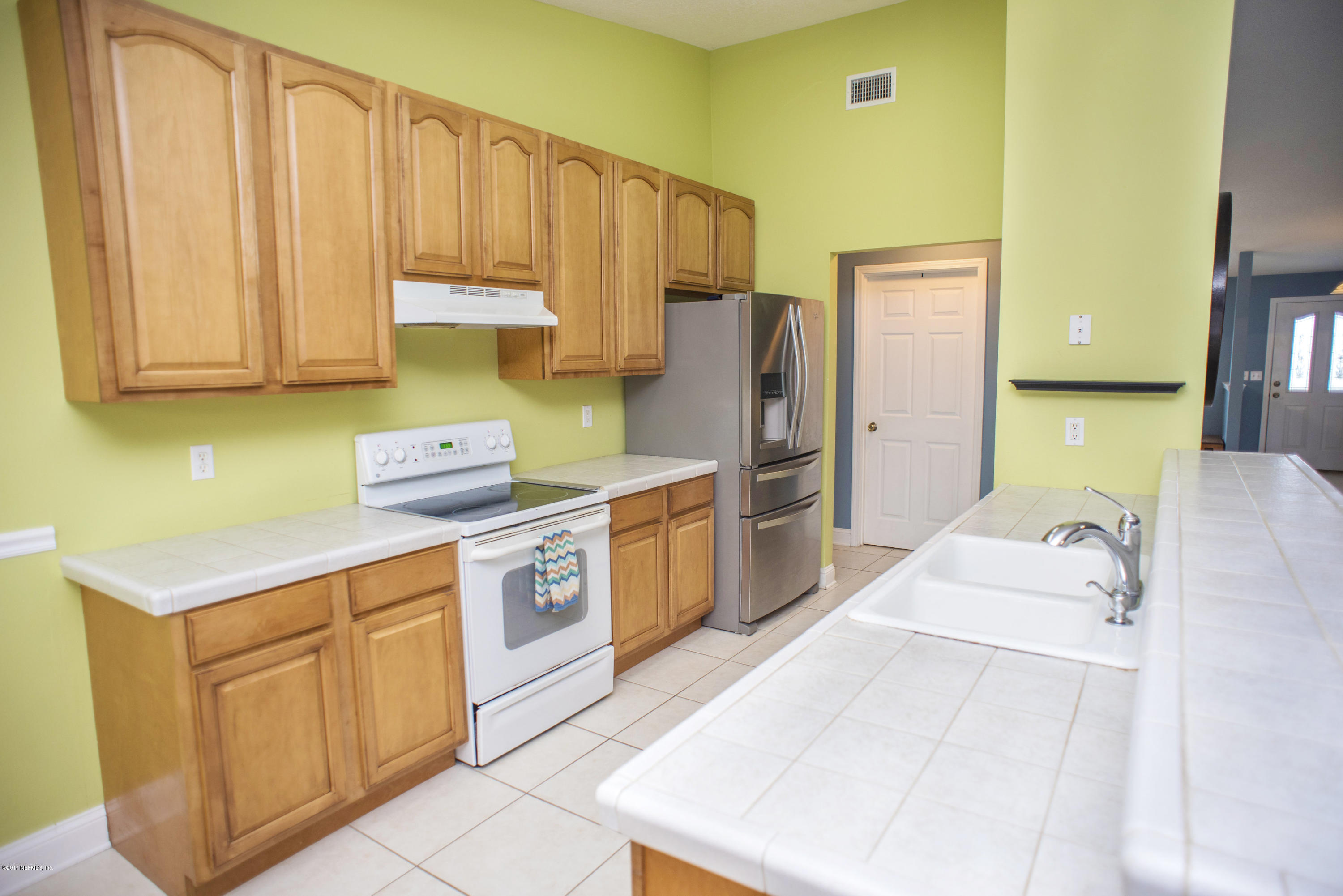 244 Barco Road St. Augustine, FL 32080 - Photo 10 of 31 a kitchen with a sink cabinets and appliances