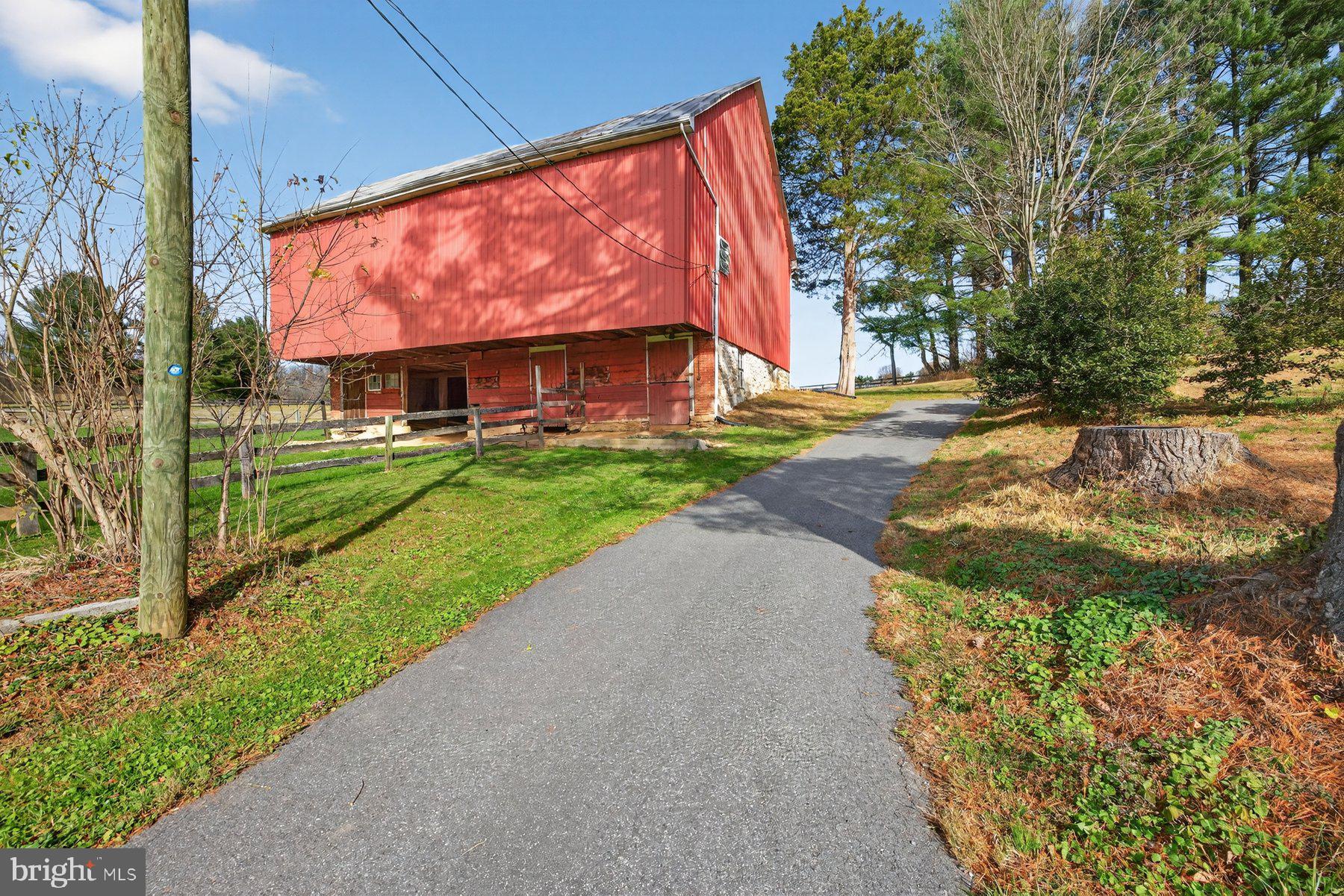 16306 Trenton Road Upperco, MD 21155 - Photo 13 of 55 a front view of a house with a yard and garage