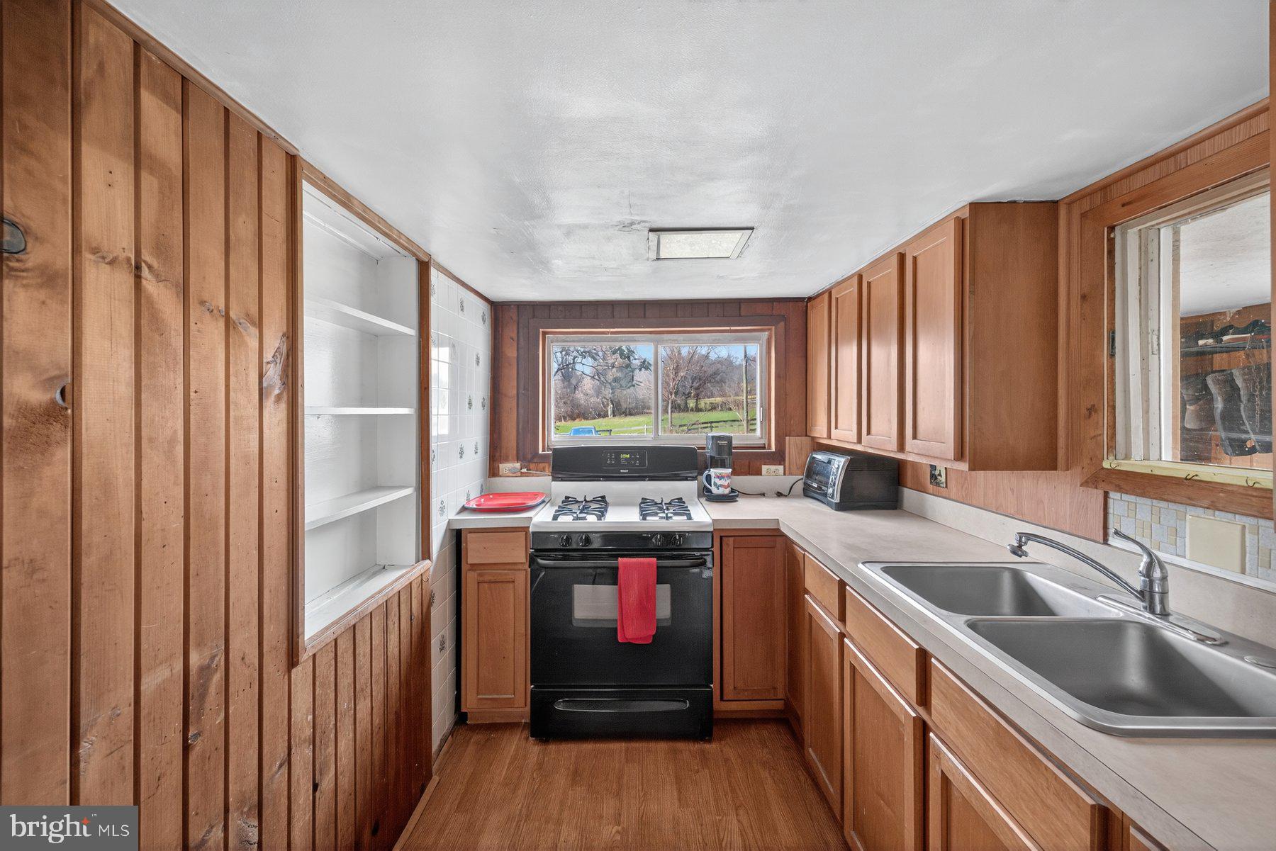 16306 Trenton Road Upperco, MD 21155 - Photo 18 of 55 a kitchen with a stove a sink and a refrigerator