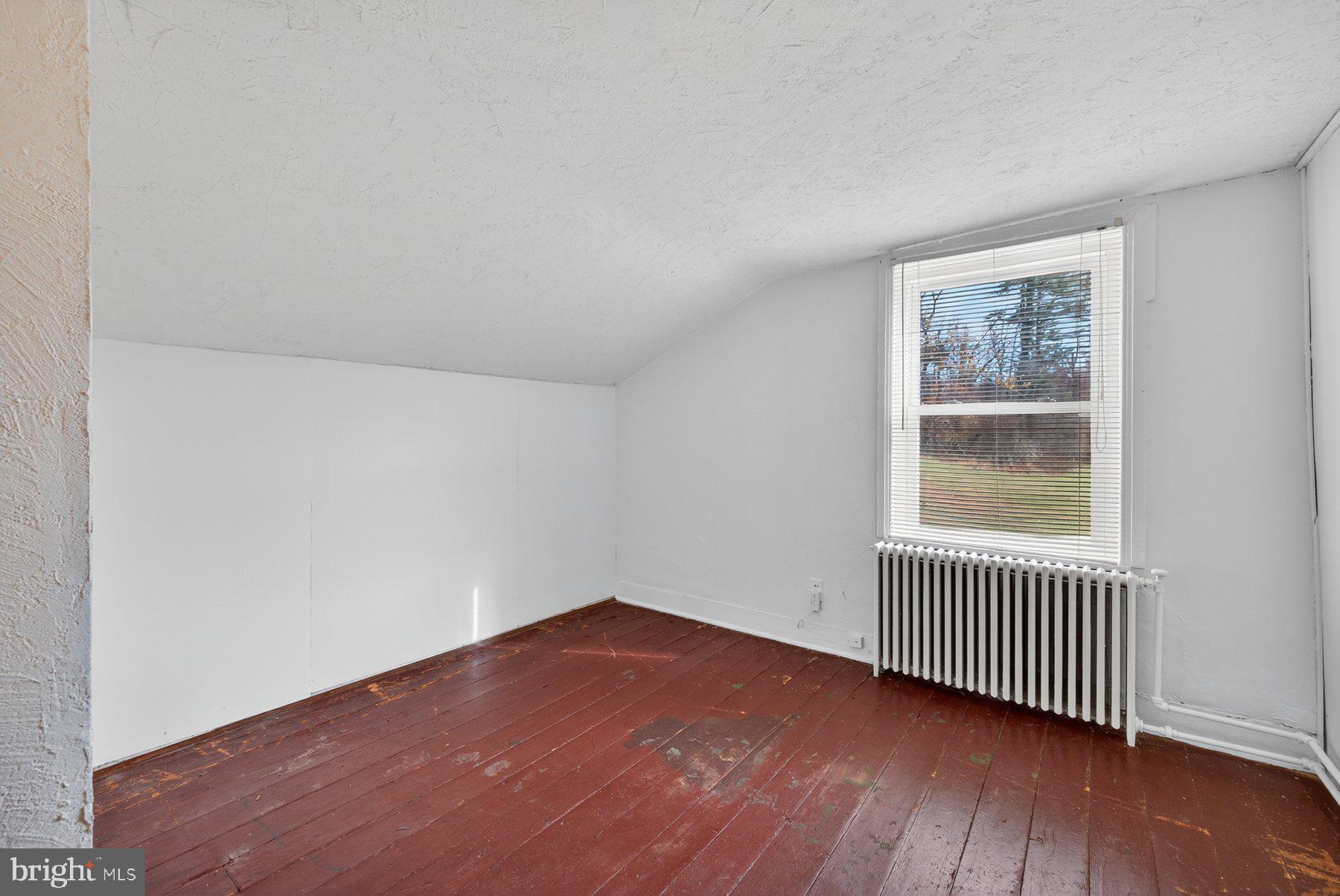 16306 Trenton Road Upperco, MD 21155 - Photo 28 of 55 an empty room with wooden floor and windows