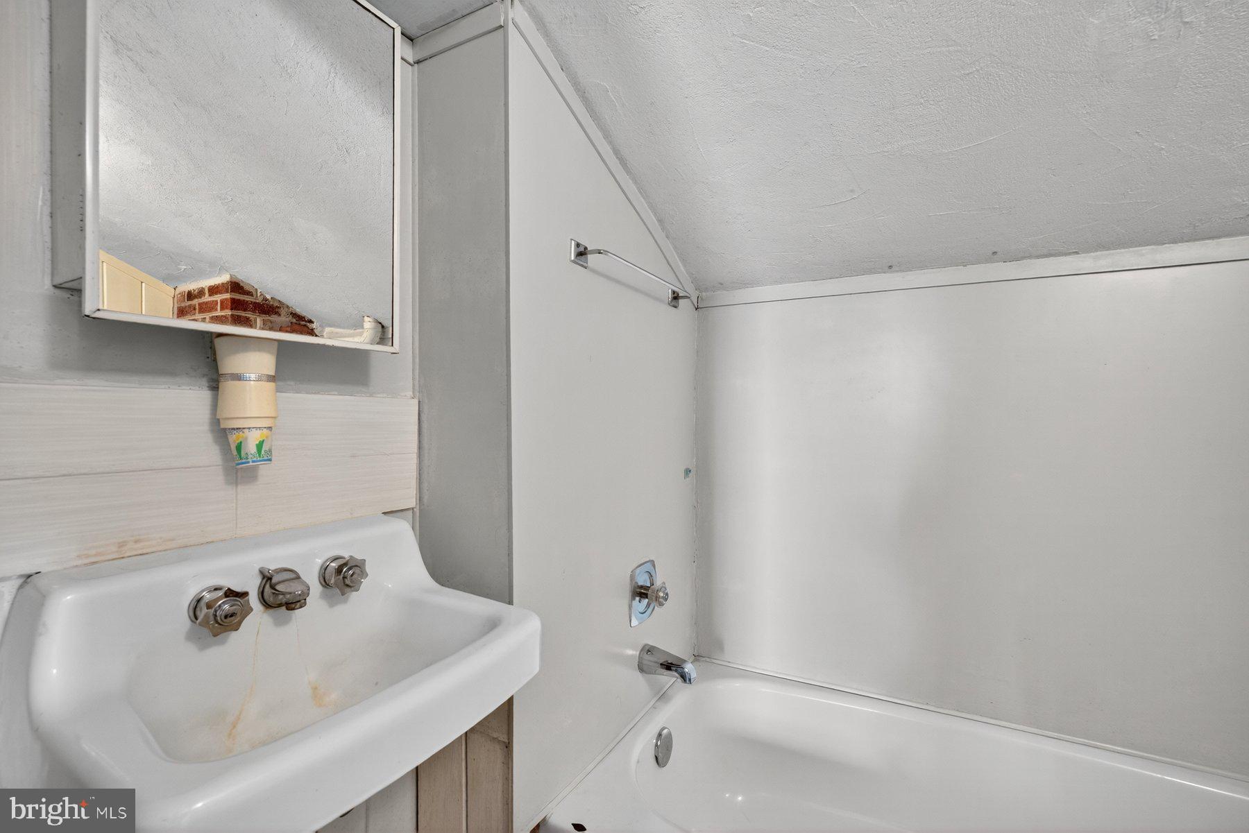 16306 Trenton Road Upperco, MD 21155 - Photo 30 of 55 a bathroom with a sink and a tub