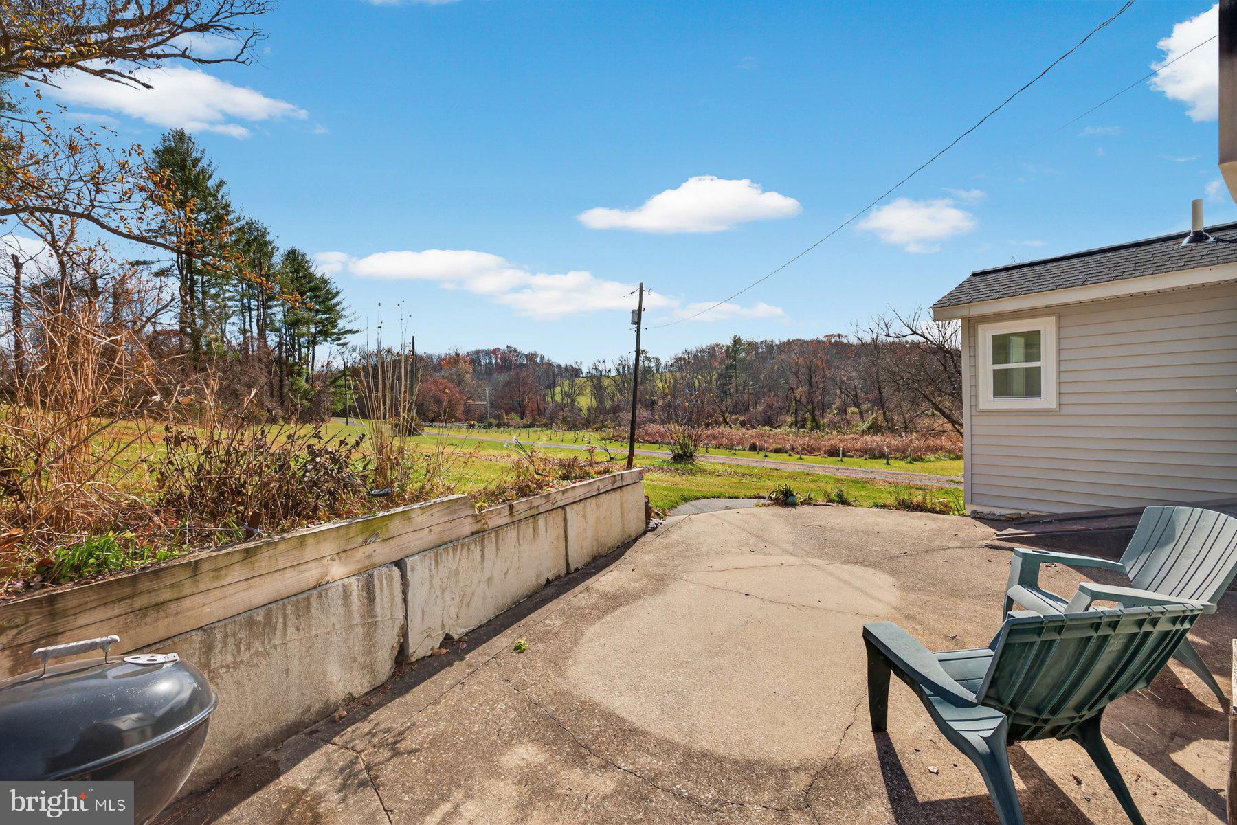 16306 Trenton Road Upperco, MD 21155 - Photo 37 of 55 a view of a house with a swimming pool and a yard