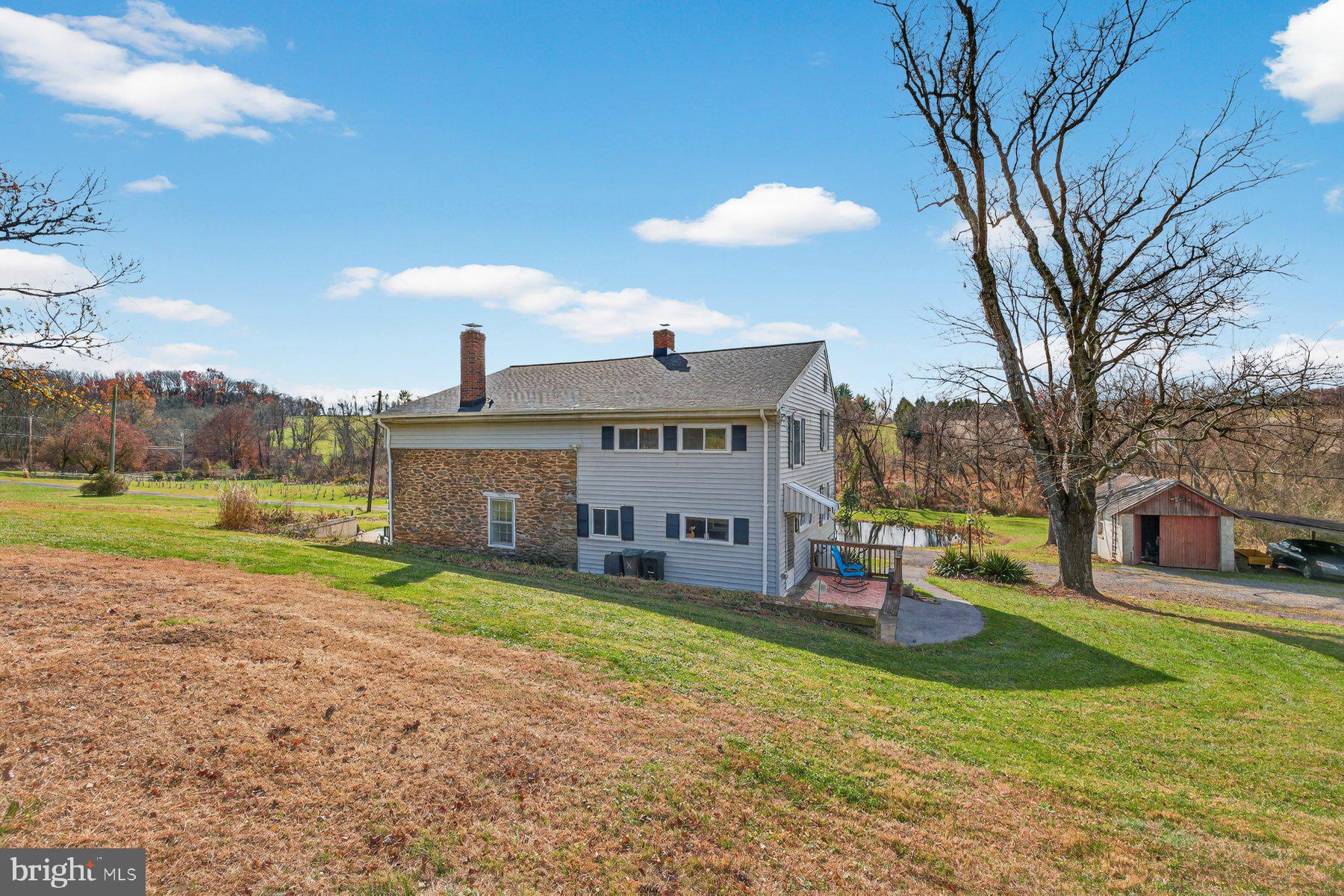 16306 Trenton Road Upperco, MD 21155 - Photo 4 of 55 a view of a house with a yard porch and sitting area