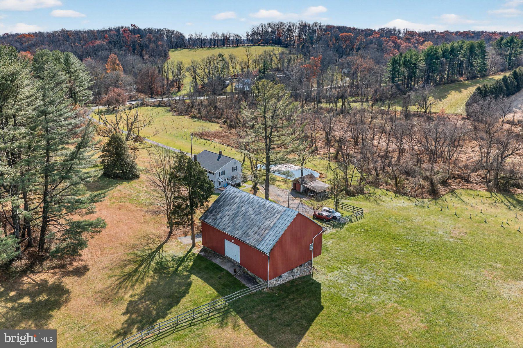 16306 Trenton Road Upperco, MD 21155 - Photo 49 of 57 a view of a house with a yard and a lake view