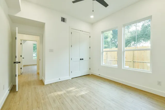 a bathroom with a bathtub and a toilet